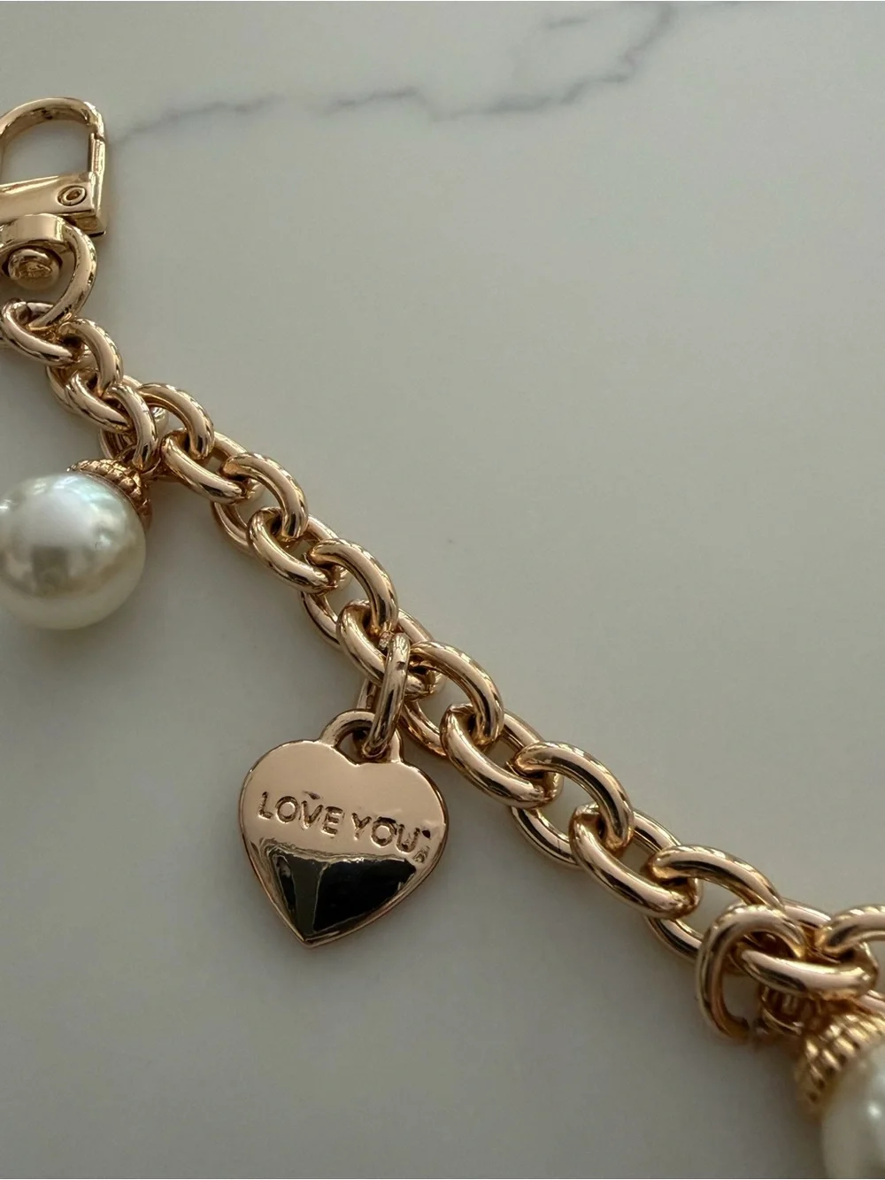 Bag Chain - gold tone with faux pearls and hearts that say “ Iove you”